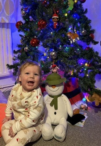 Photo of child with a Christmas hamper